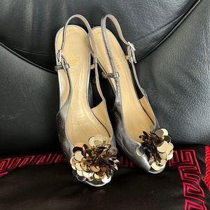 Beautiful and charming Kate Spade sling back peep toes shoes.